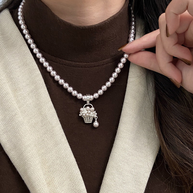 Manta rose Swarovski pearl basket necklace