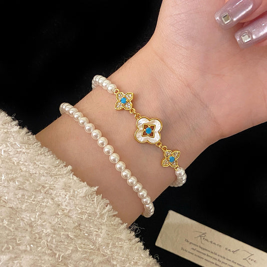 Natural Fritillaria shell with four leaves full of diamonds Swarovski pearl bracelet.