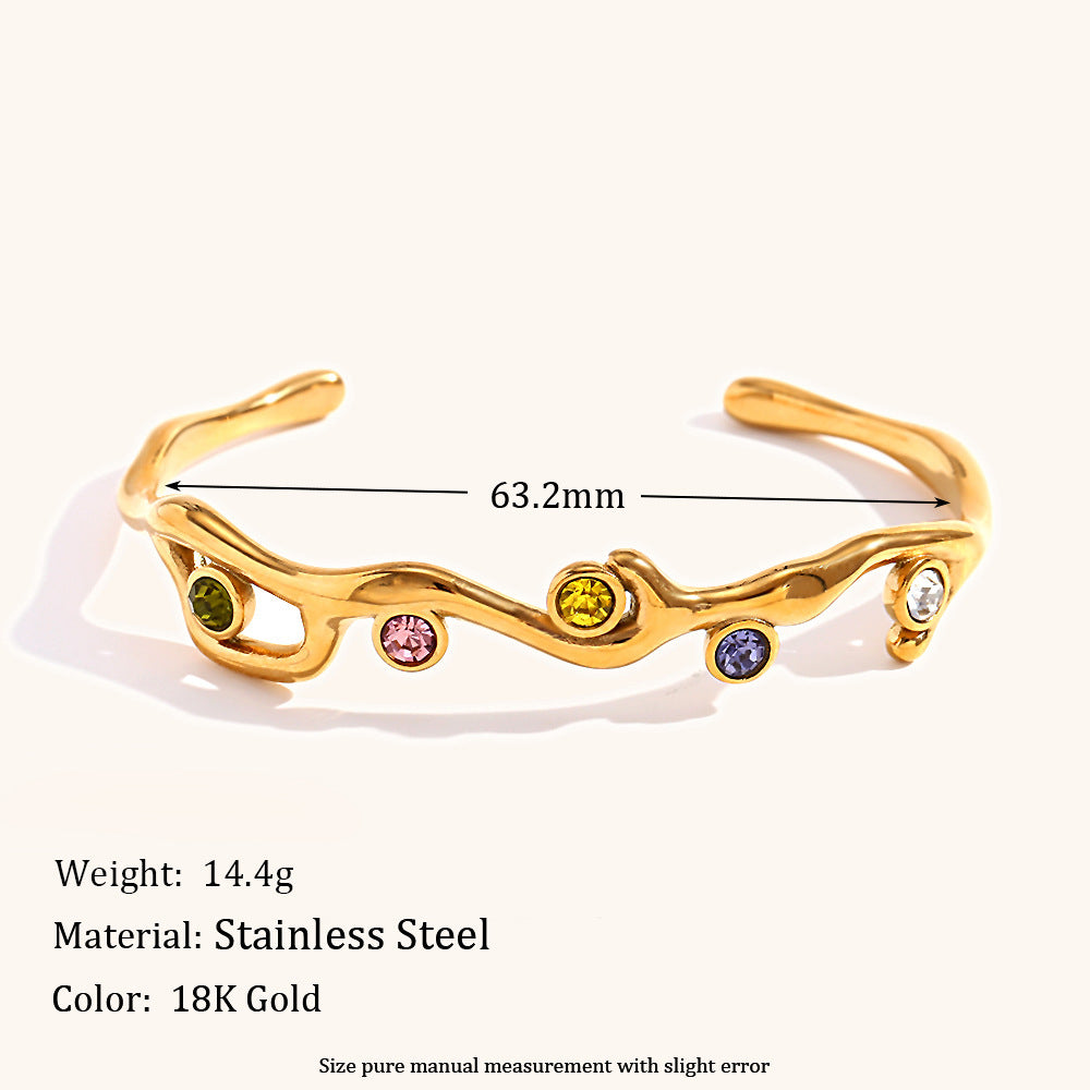 Colored diamond bracelet with stainless steel branches plated with 18K gold.