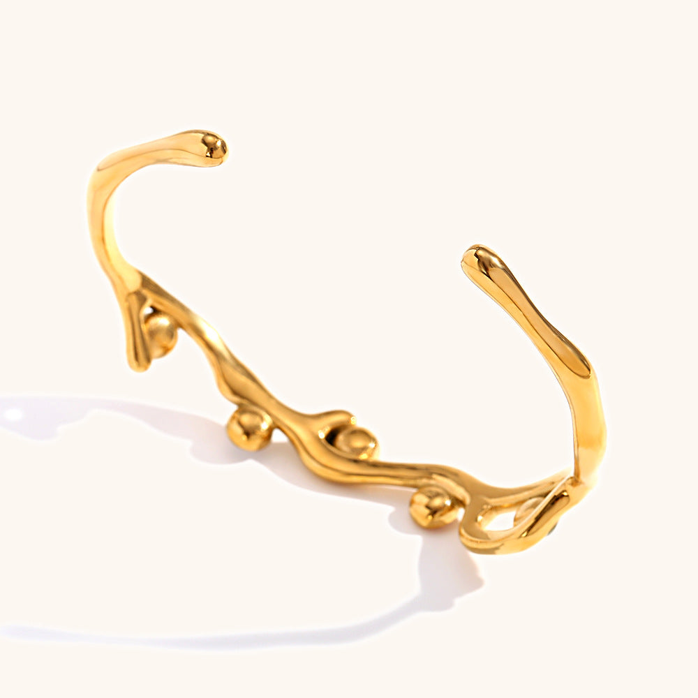 Colored diamond bracelet with stainless steel branches plated with 18K gold.