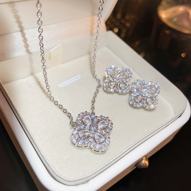 Silver needle hollow zircon flower earring necklace set