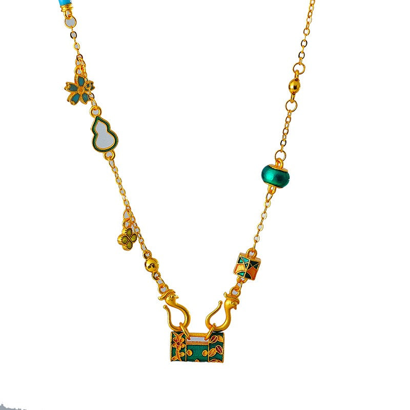 ゴールドバーニングブルーエナメルロックバッグネックレス