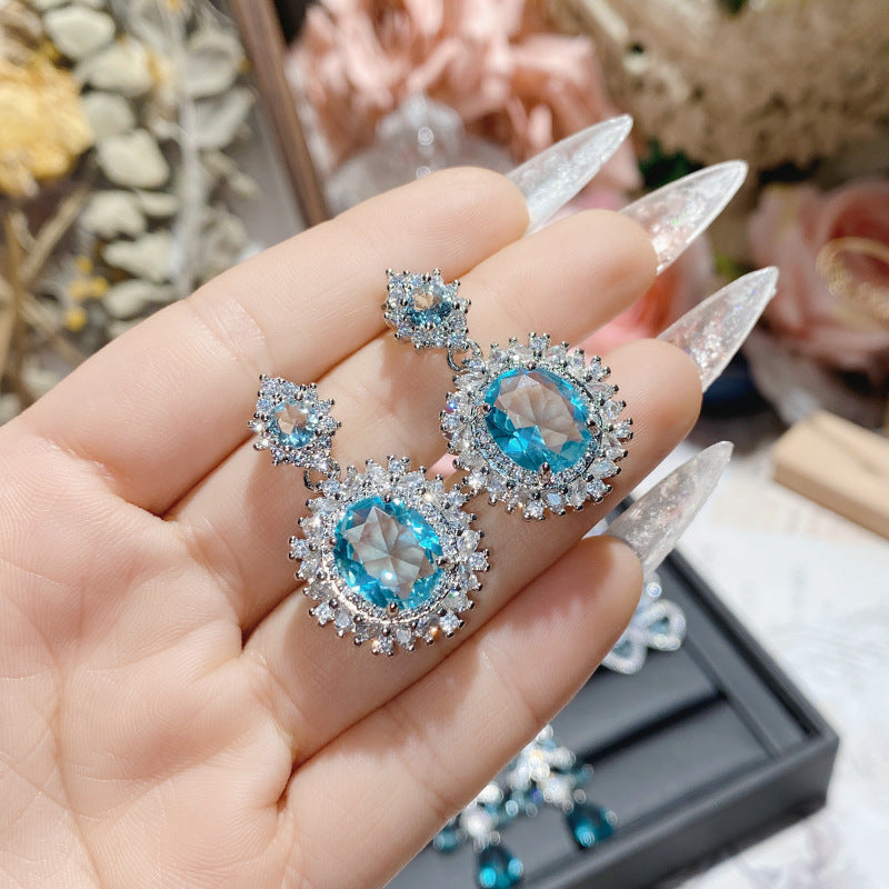 Aquamarine plated 18K gold love bow earrings