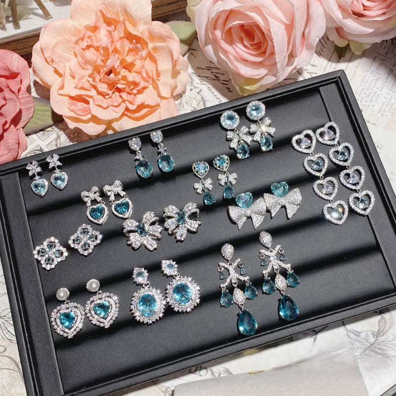 Aquamarine plated 18K gold love bow earrings