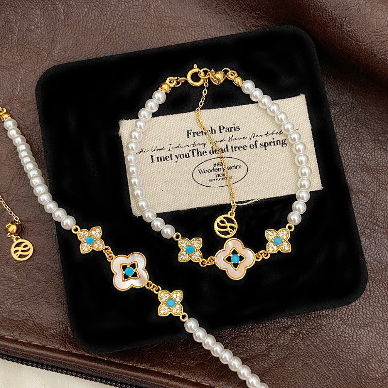 Natural Fritillaria shell with four leaves full of diamonds Swarovski pearl bracelet.