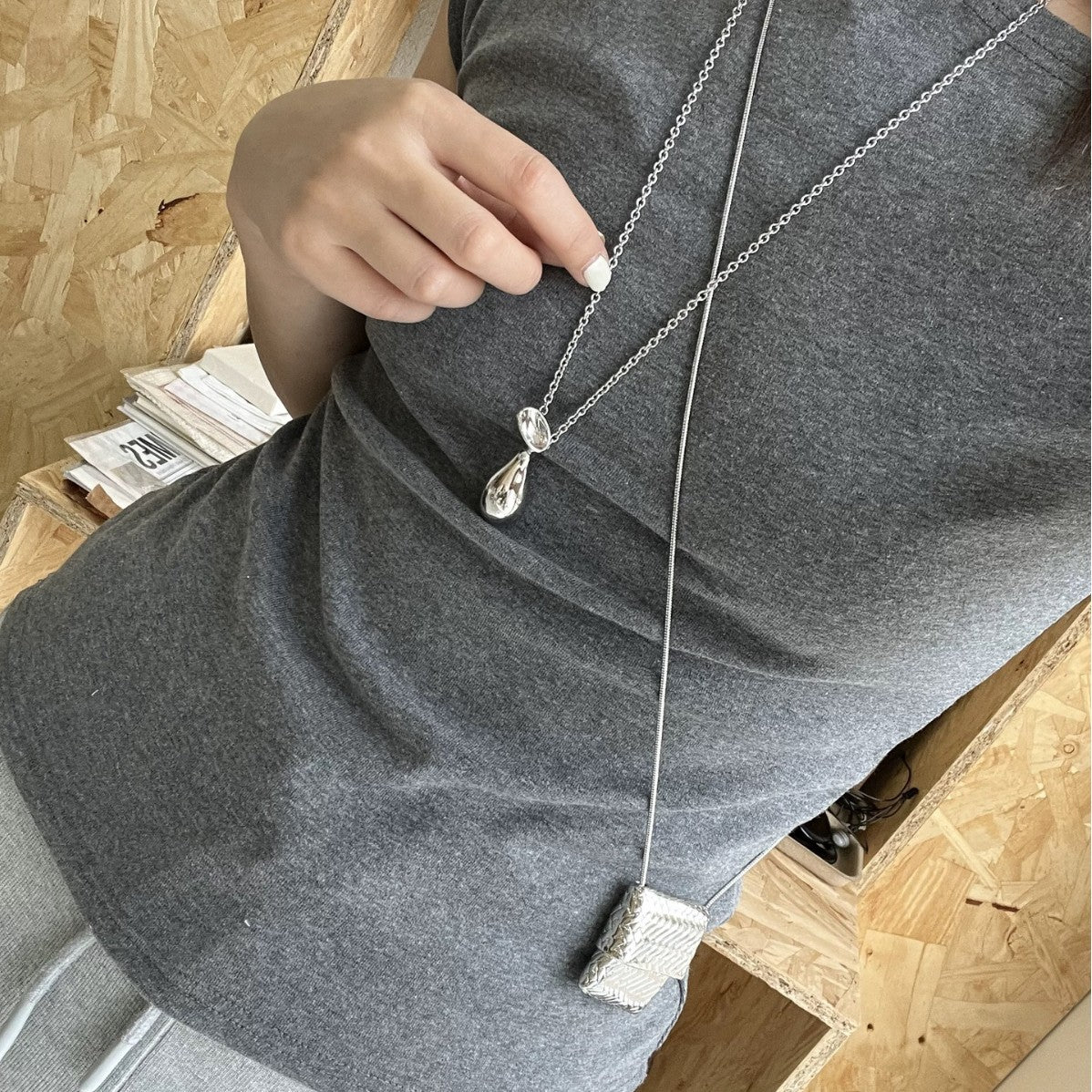 Silver braided bag necklace