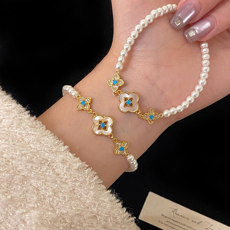 Natural Fritillaria shell with four leaves full of diamonds Swarovski pearl bracelet.