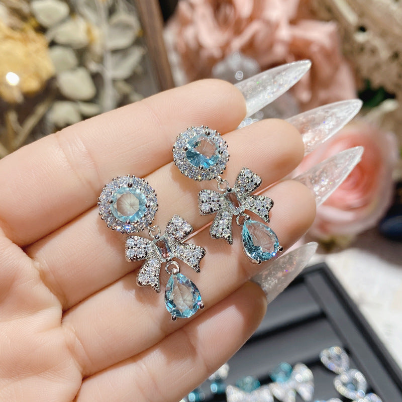 Aquamarine plated 18K gold love bow earrings