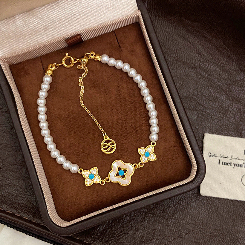 Natural Fritillaria shell with four leaves full of diamonds Swarovski pearl bracelet.