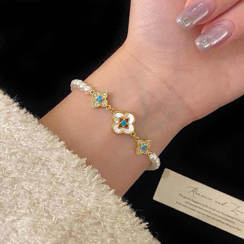 Natural Fritillaria shell with four leaves full of diamonds Swarovski pearl bracelet.