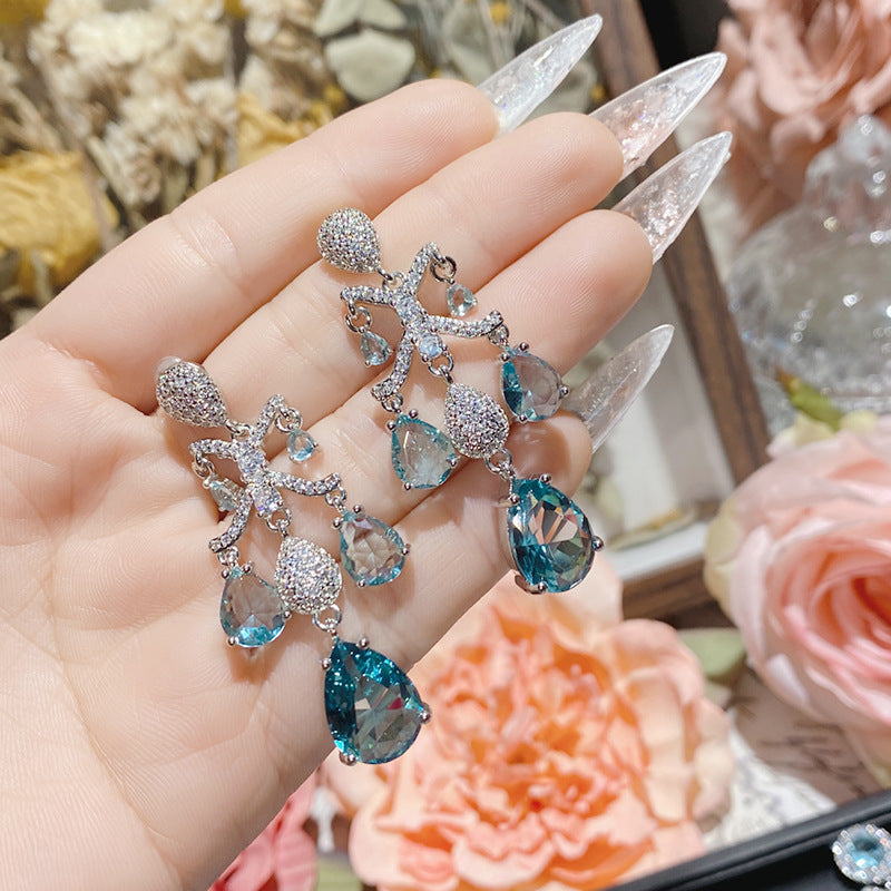 Aquamarine plated 18K gold love bow earrings