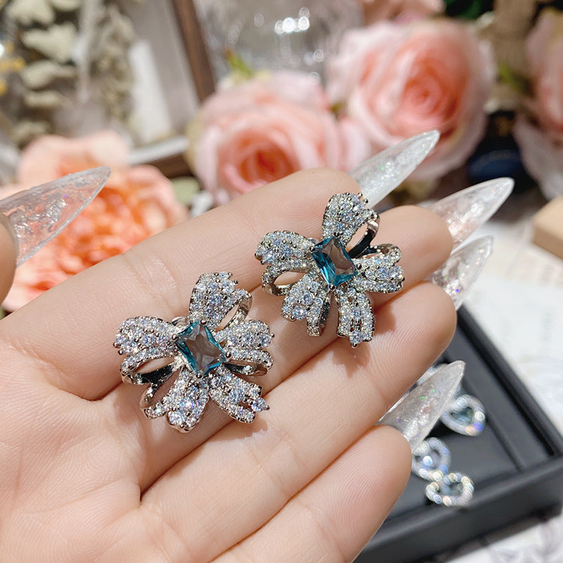 Aquamarine plated 18K gold love bow earrings