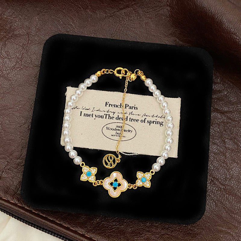 Natural Fritillaria shell with four leaves full of diamonds Swarovski pearl bracelet.