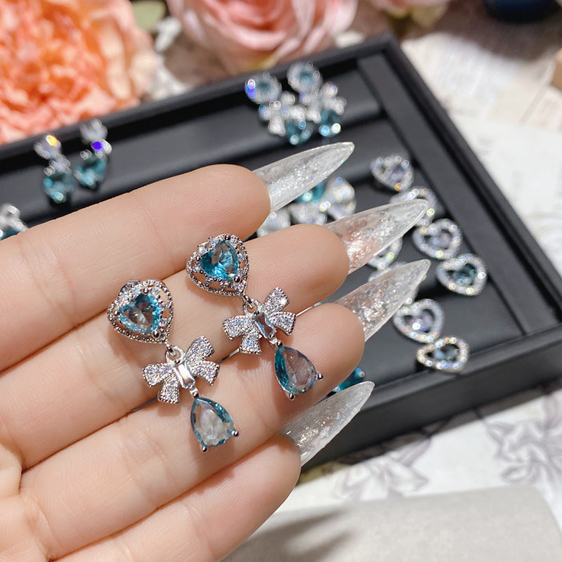 Aquamarine plated 18K gold love bow earrings