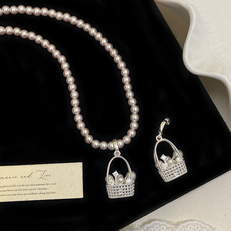 Manta rose Swarovski pearl basket necklace