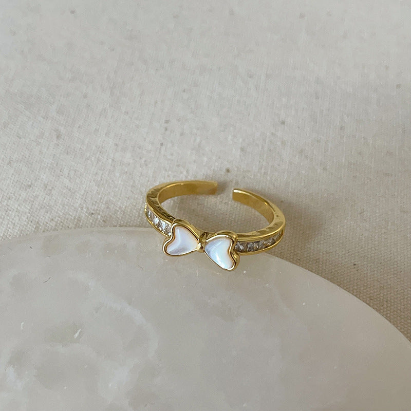 Dropping butterfly flower opening ring